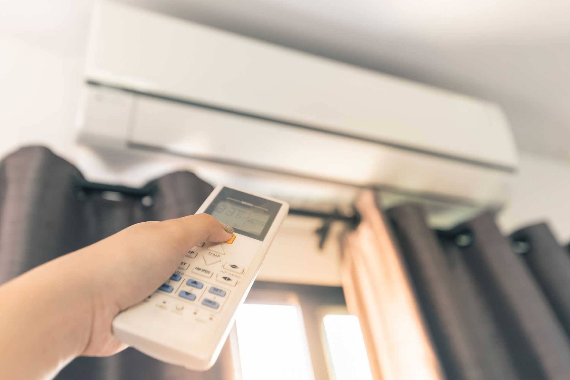 Turning on Air Conditioner — Nashville, TN — Hermitage Heating & Air Conditioning Turning on Air Conditioner — Nashville, TN — Hermitage Heating & Air Conditioning