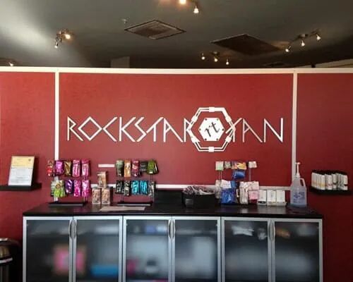 A red wall with the word rockstar on it