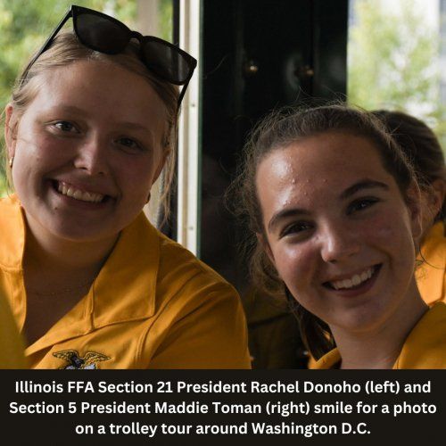 Two young women in yellow shirts smiling on a trolley tour in Washington D.C.