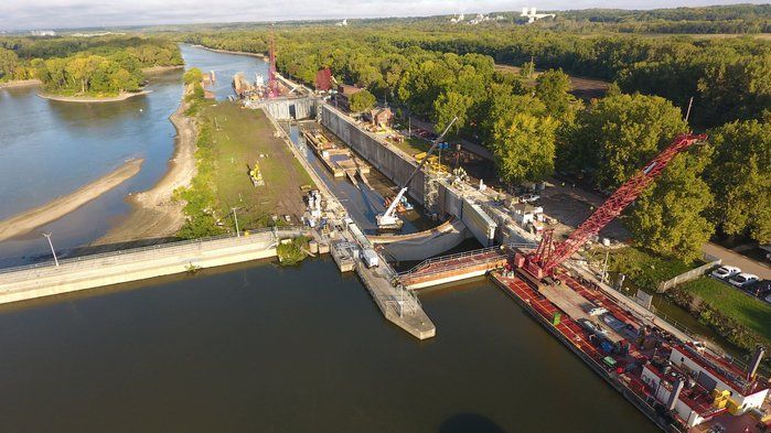 An aerial view of a bridge being built over a river.