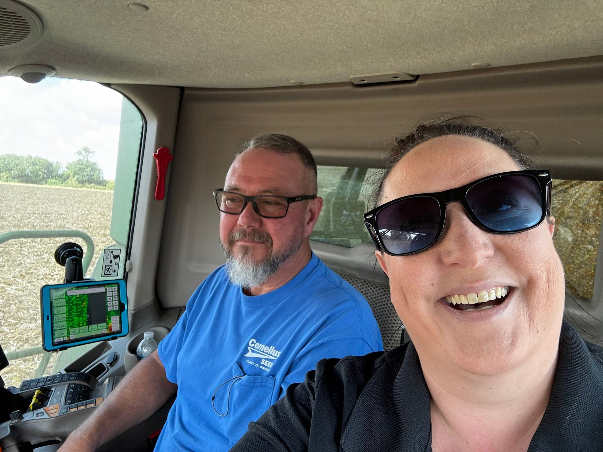 tara in the cab with cliff during harvest