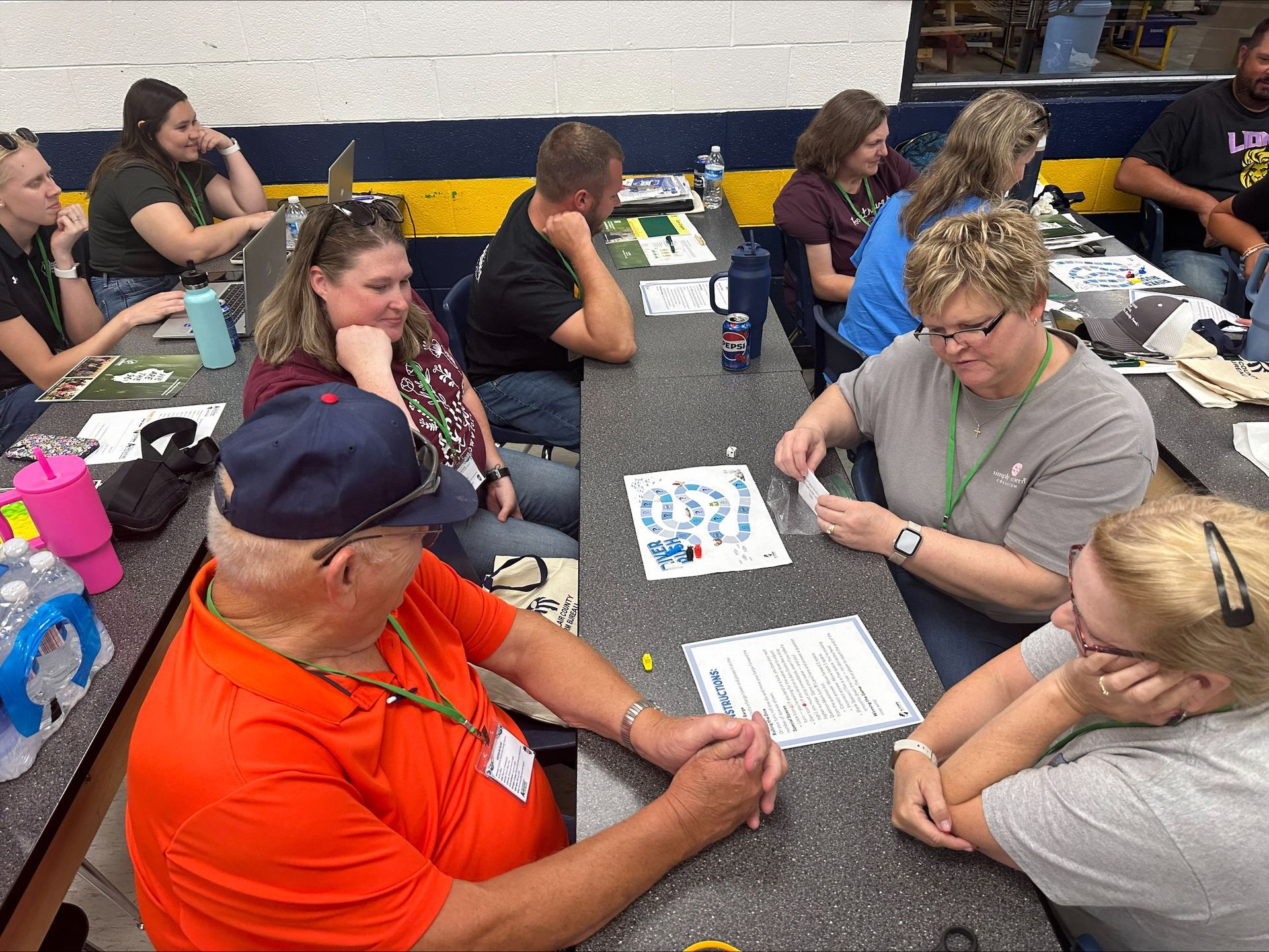 teachers playing new lock and dam game created by interns