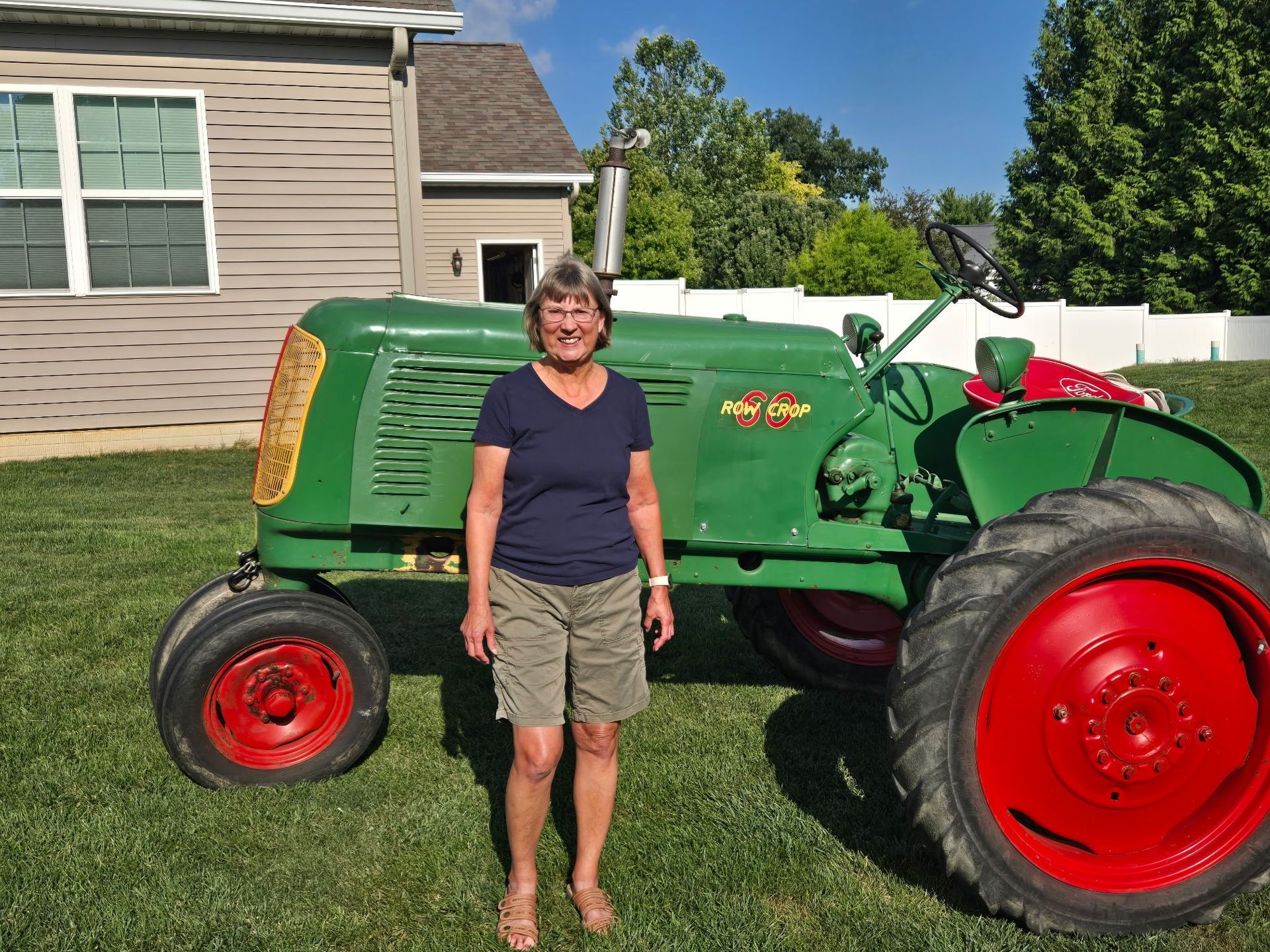Joan (Kent's wife) in front of machinery