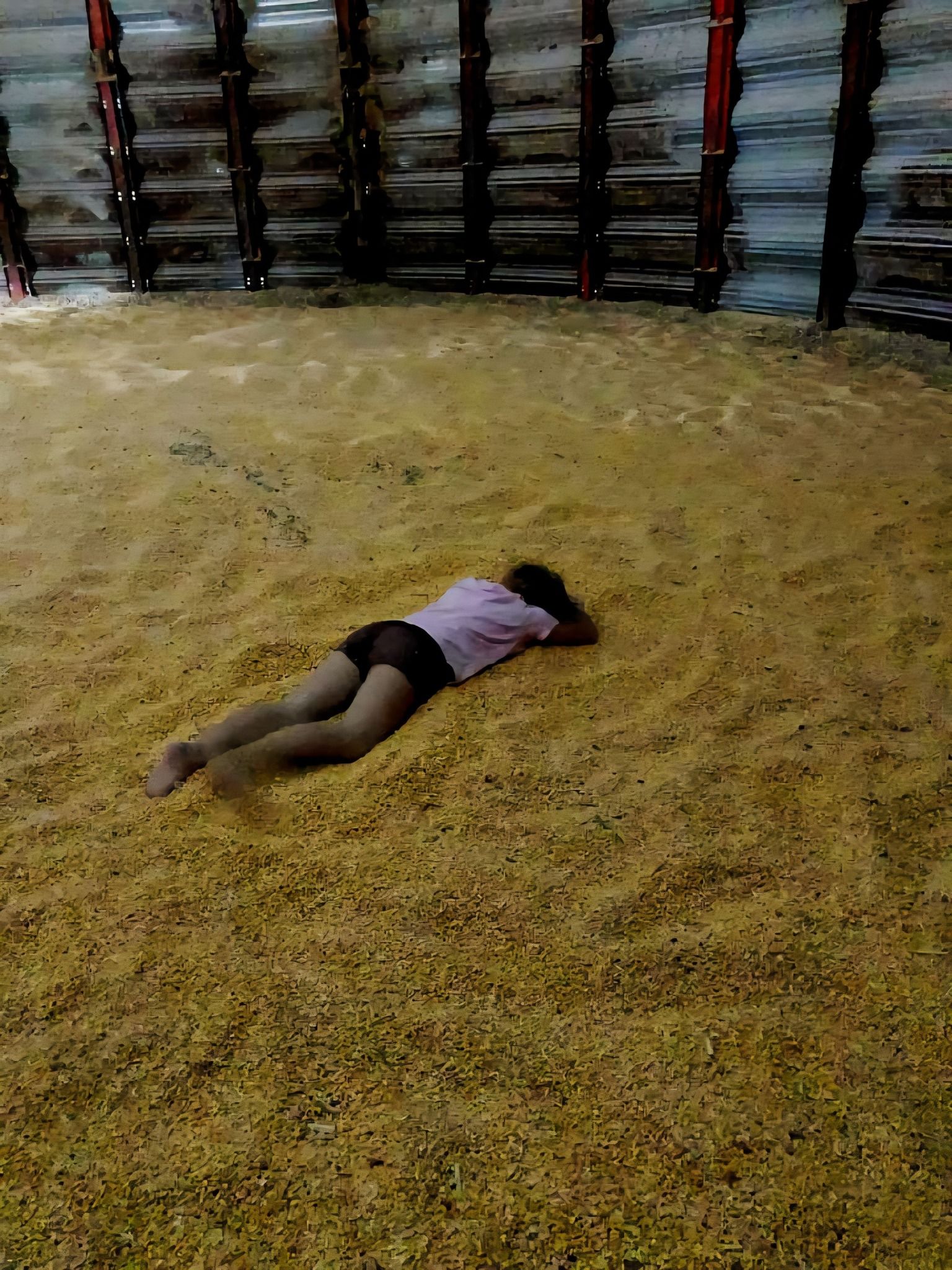 photo contest winner - photo of a kid laying down in a small pile of field corn inside a grain bin