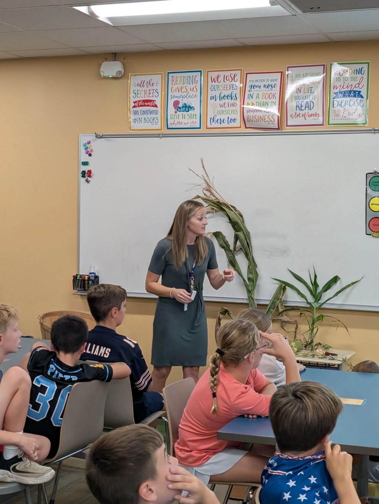 Megan talking corn in a classroom
