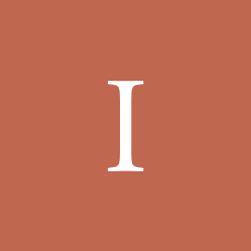 White letter “I” on a terracotta-colored background.