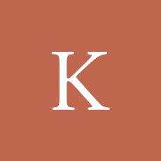 White letter “K” on a terracotta background.