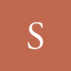 White letter “S” on a muted terracotta square background.