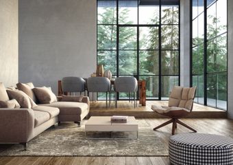 A living room with a couch , chair , coffee table and large windows. A living room with a couch , chair , coffee table and large windows.