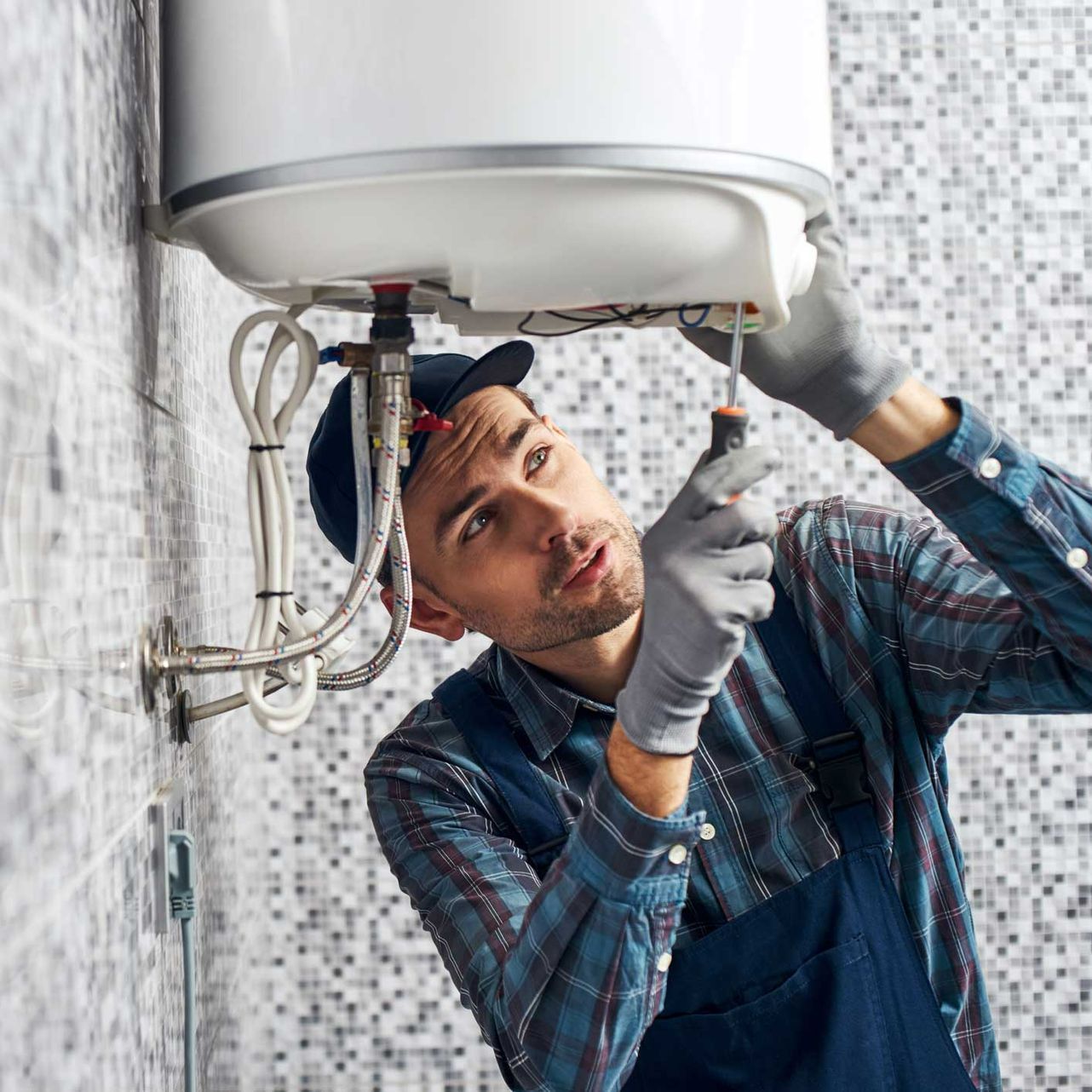 Technician Repairing Water Heater — Stockton, NJ — Custom Cooling Services LLC