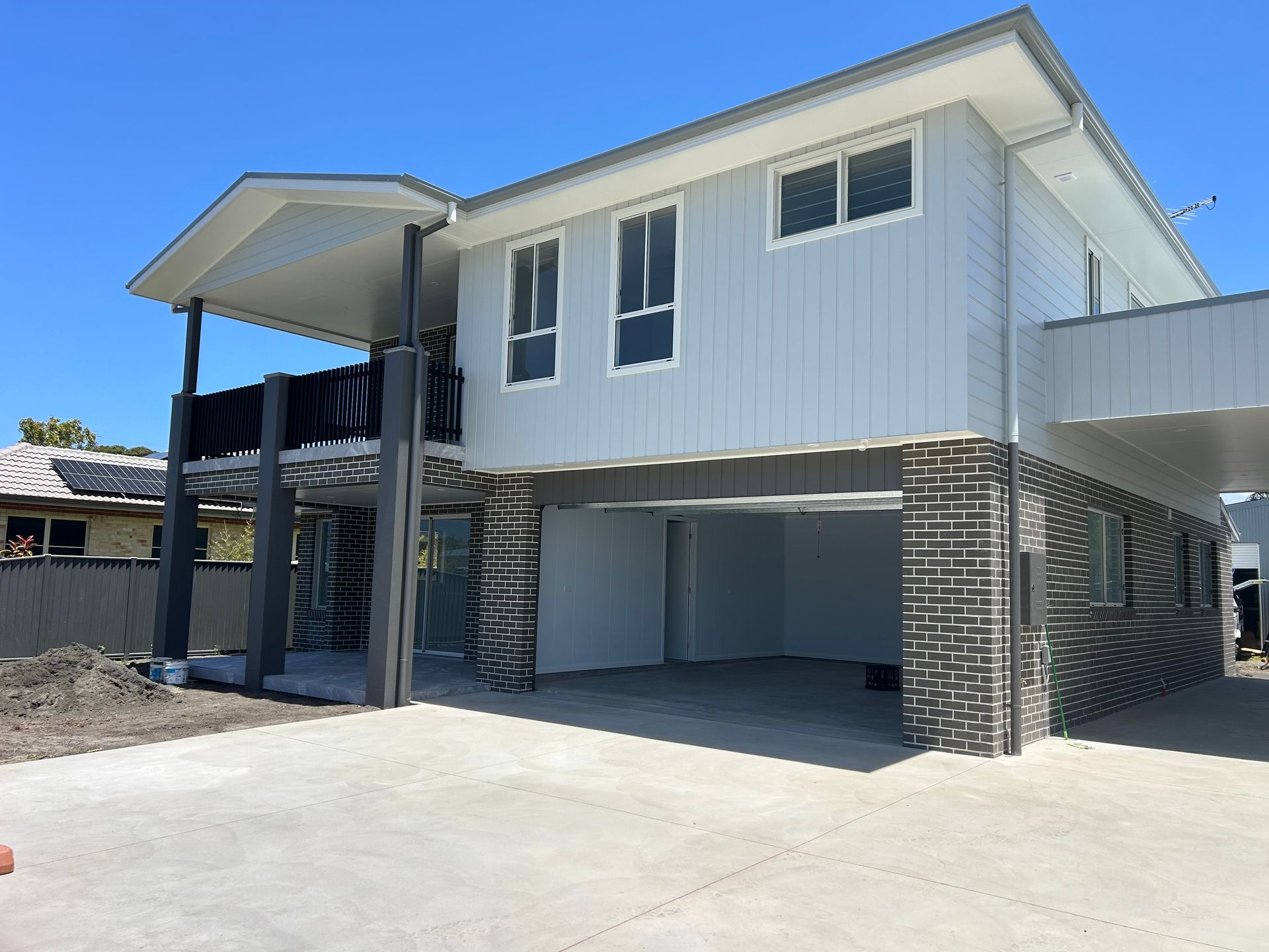 Two-story white house with brick pillars — C & S Building In Bentley, NSW