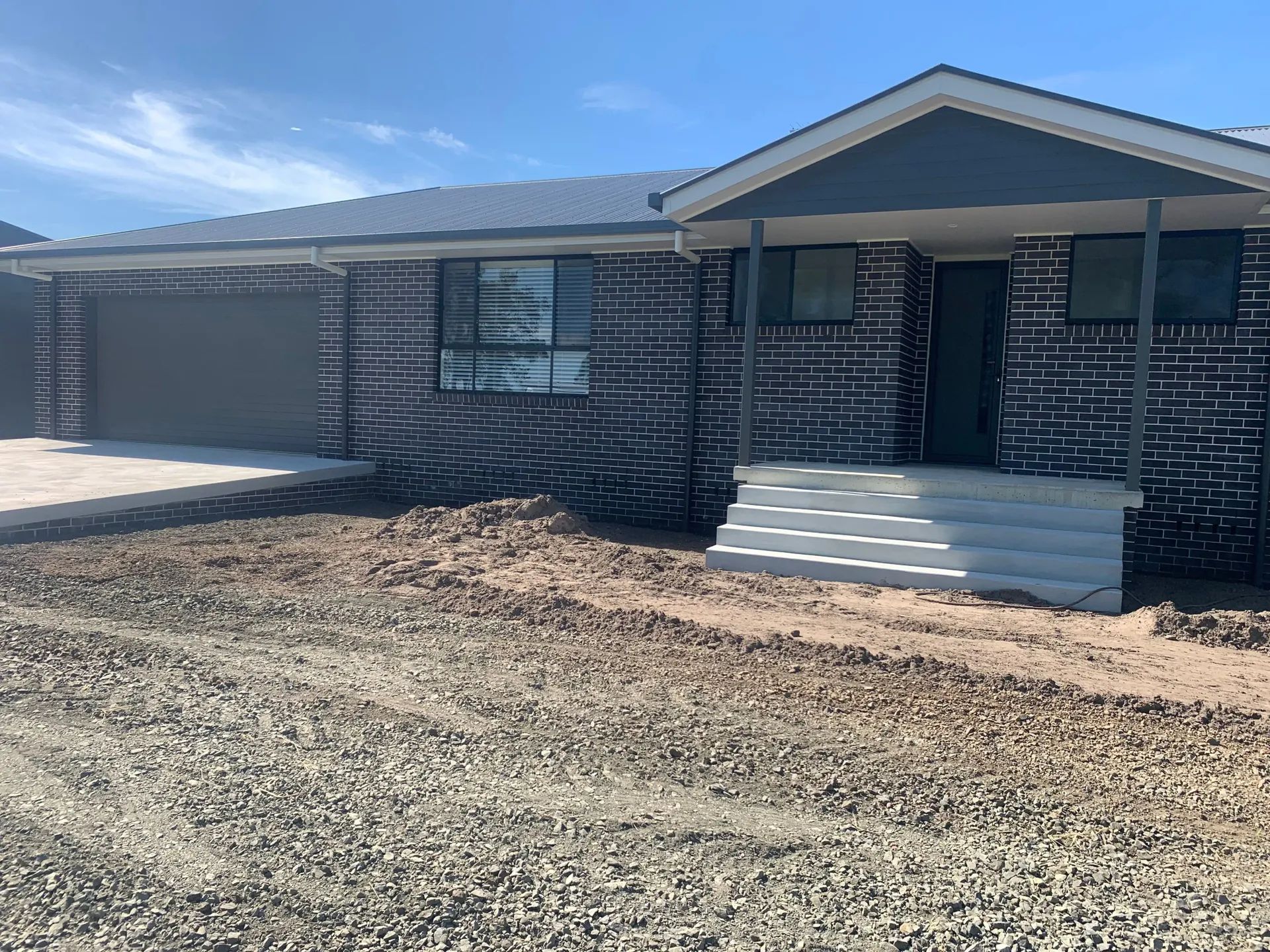 Brick House with A Small Porch and Driveway — C & S Building In Alstonville, NSW