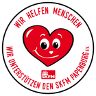 Ein rotes Herz mit einem lächelnden Gesicht und den Worten „Wir helfen Menschen“