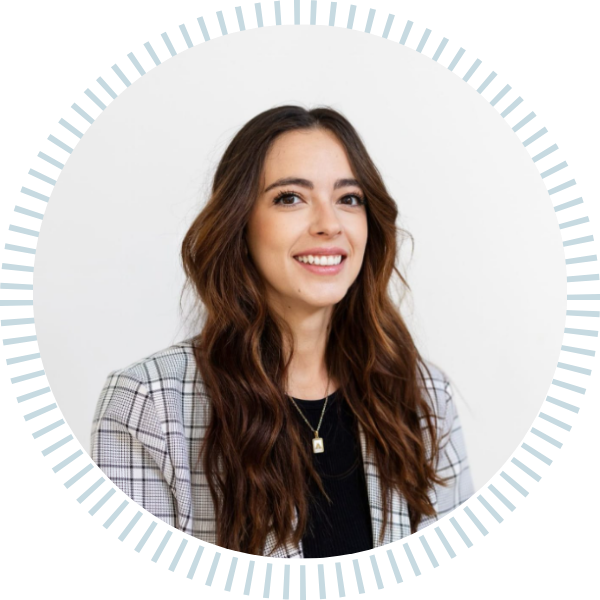 A woman in a plaid jacket is smiling in a circle