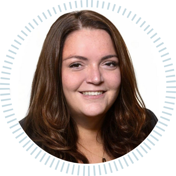 A woman with long brown hair is smiling in a circle