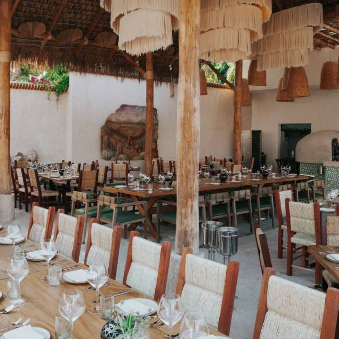 A restaurant with a lot of tables and chairs