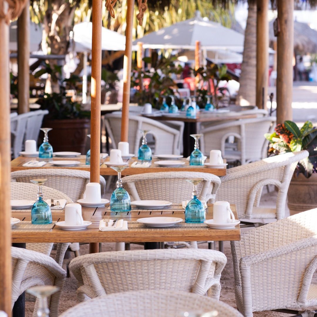 A restaurant with a lot of tables and chairs
