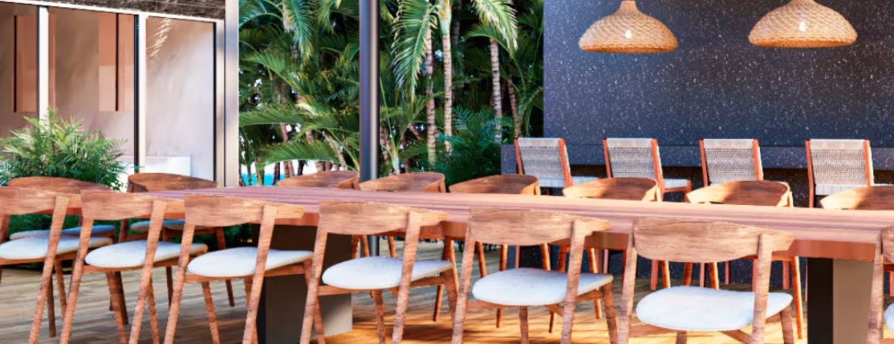 A dining room with a long wooden table and chairs.