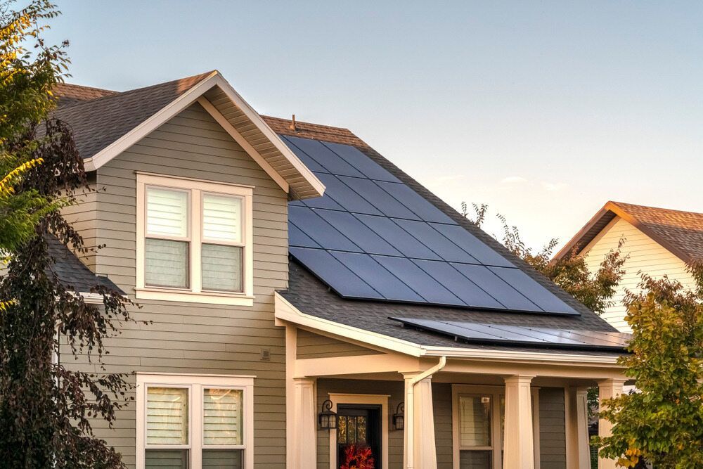 A House With Solar Panels on the Roof — B2B Electrical and Solar In Currimundi, QLD A House With Solar Panels on the Roof — B2B Electrical and Solar In Currimundi, QLD