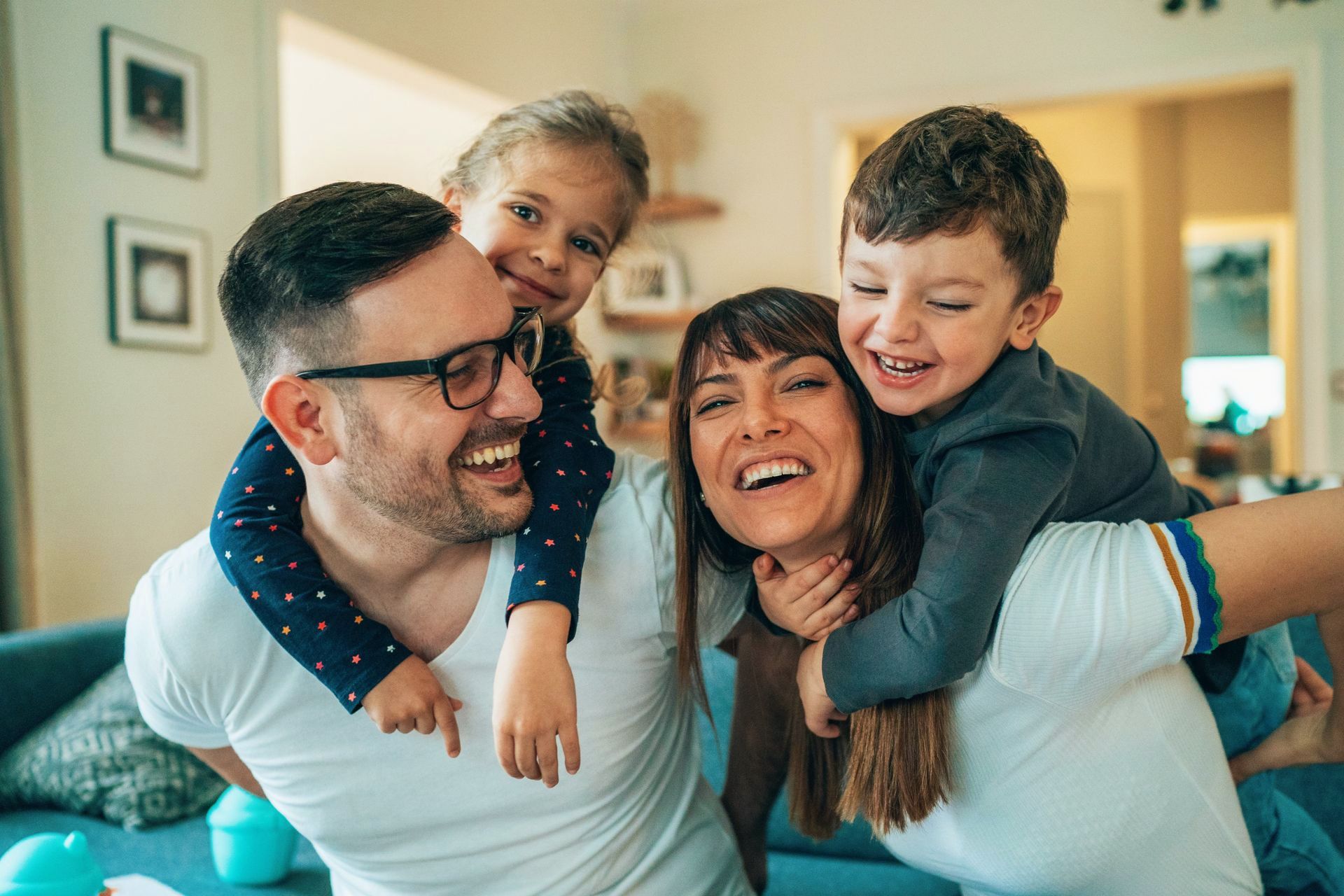 A family is standing in front of a house.