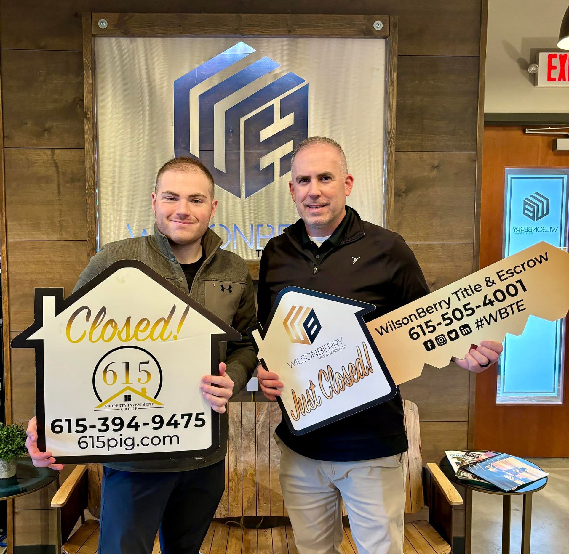 Real estate agent and client holding