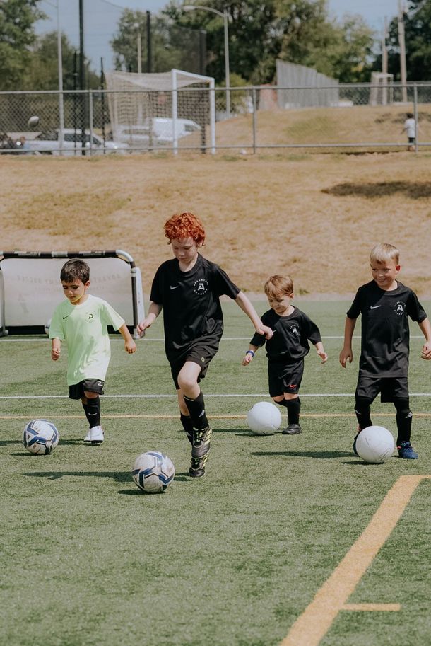 An Advantage Academy team sitting on the field