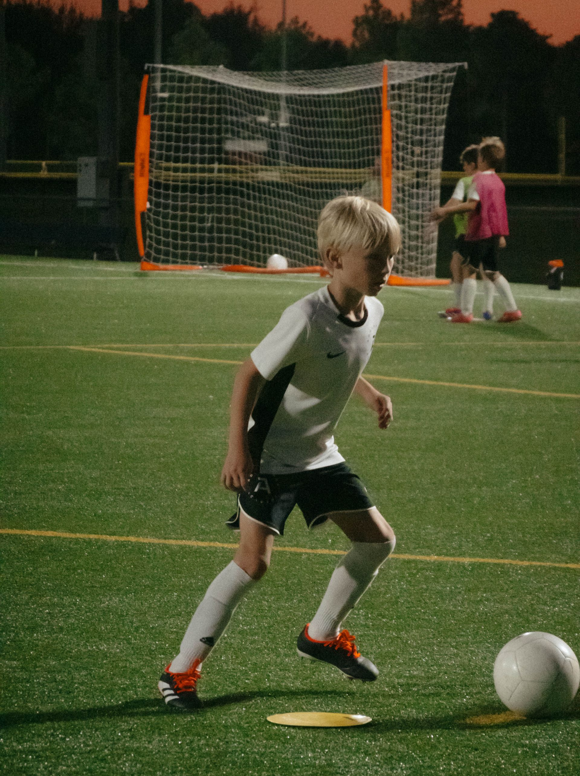 An Advantage Academy youth player dribbling the ball