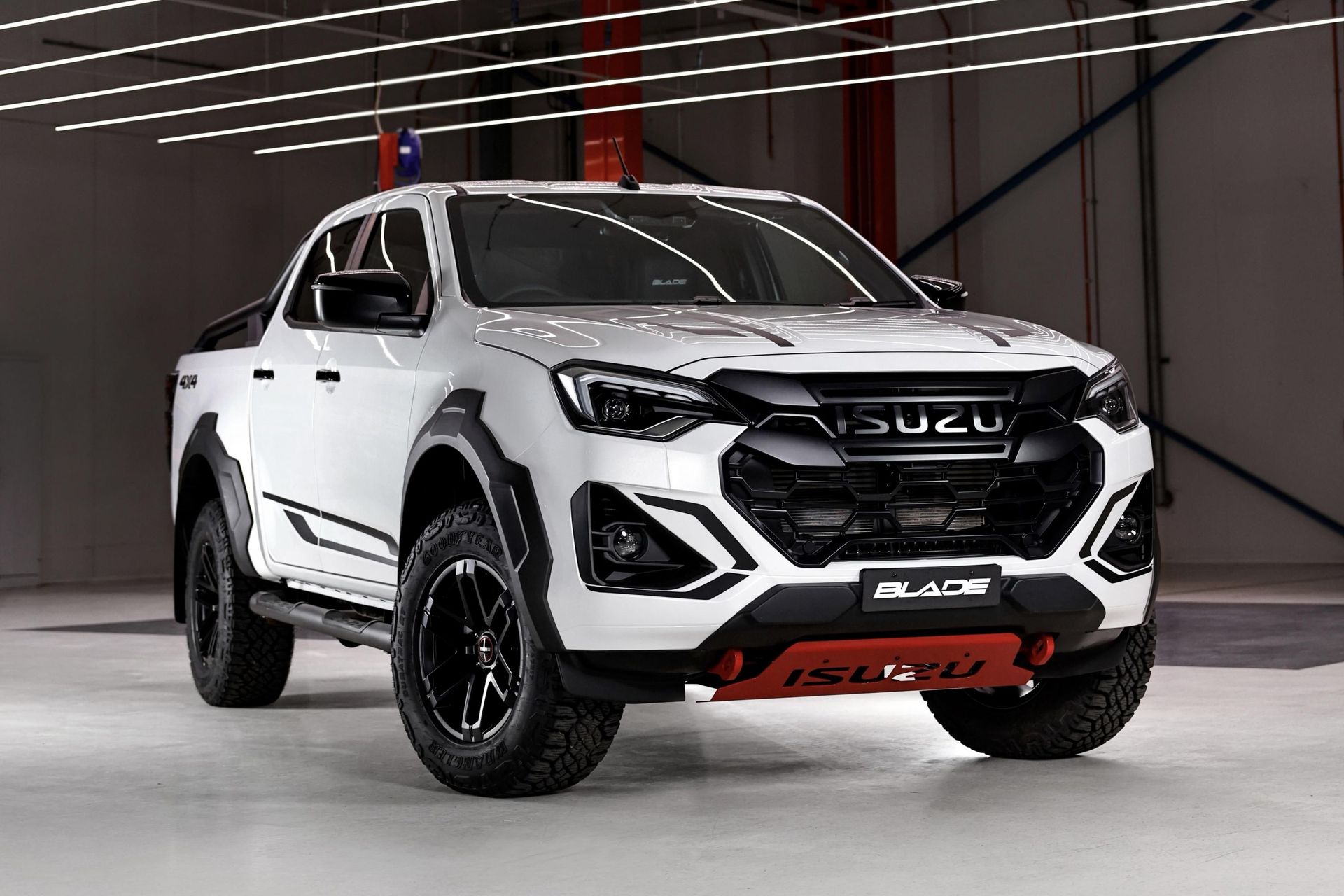 White Isuzu D-Max pickup truck, black accents, red lower bumper, dark tyres