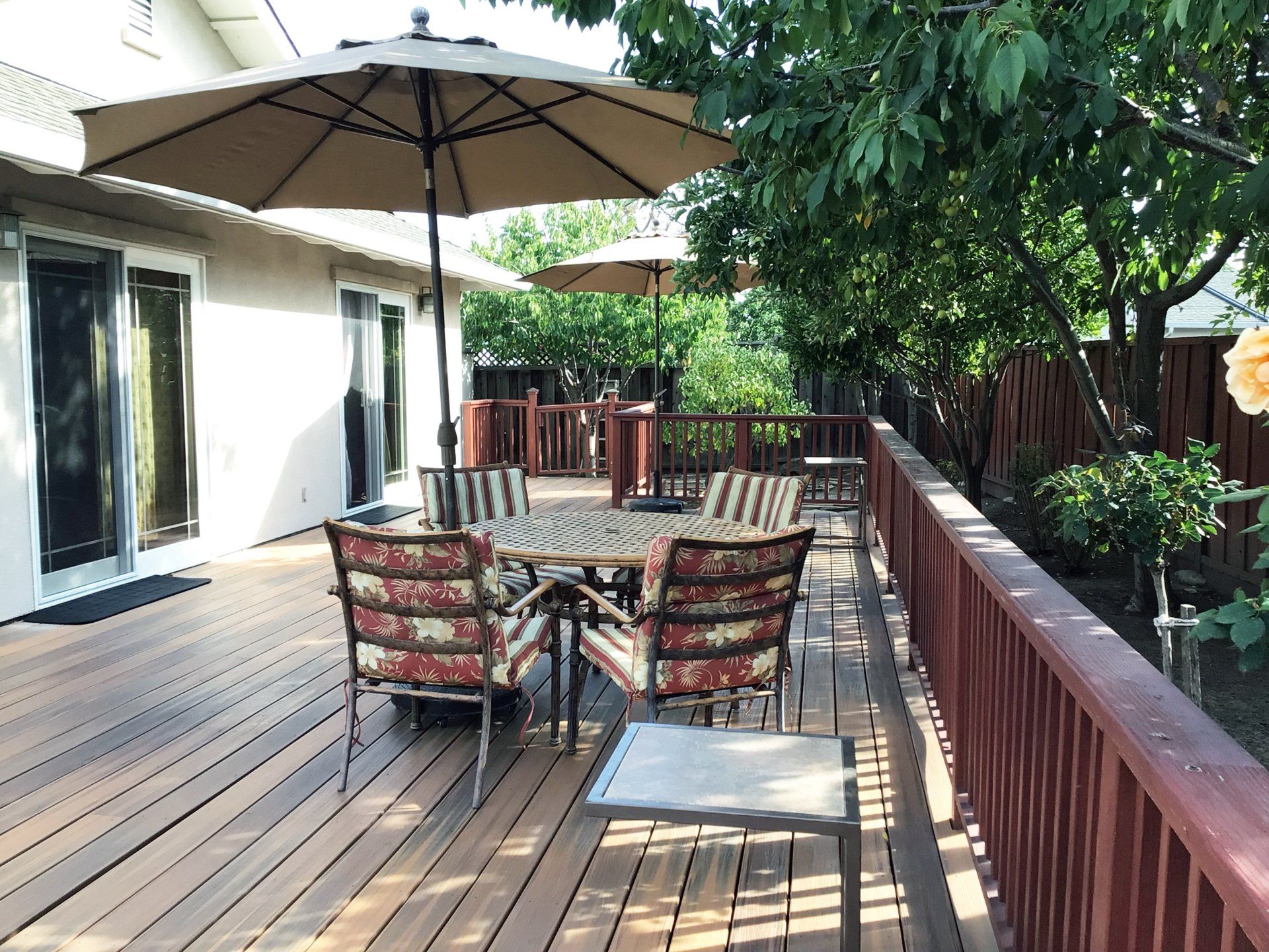patio with table and umbrella