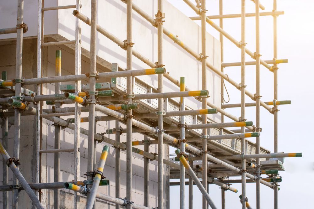 Scaffolding on a Concrete Building Under Construction, Bright Sunlight — NRS Scaffolding Pty Ltd in Kempsey, NSW