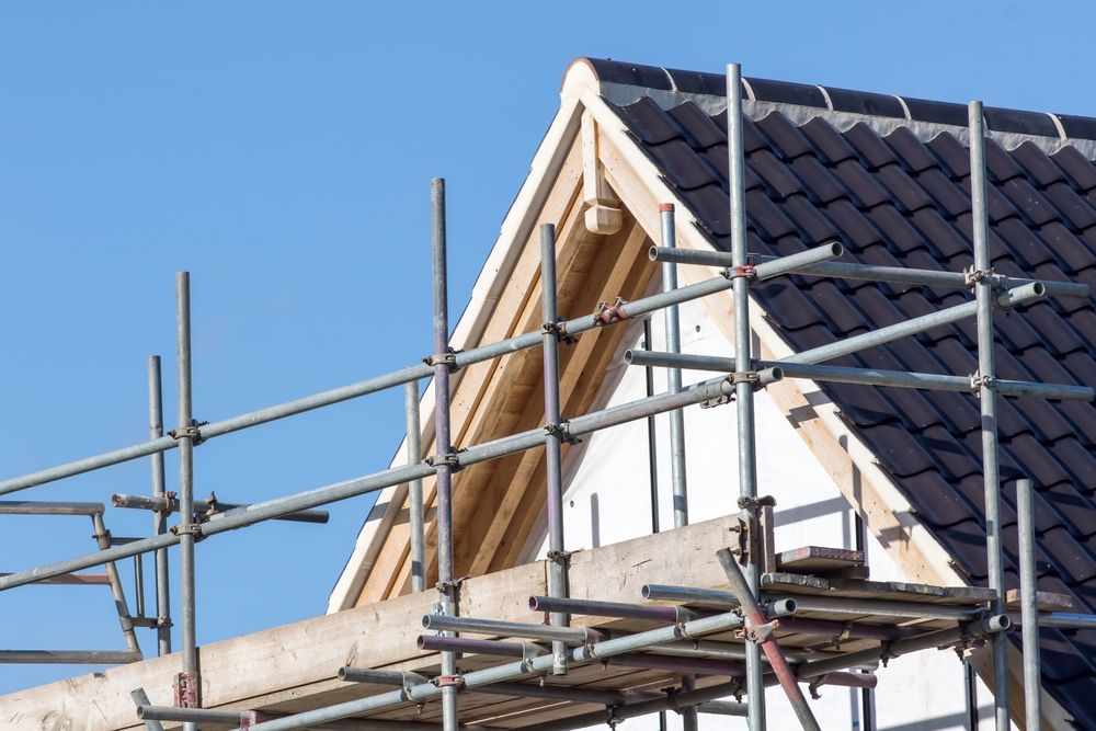 A House is Being Built With Scaffolding on the Side of It — NRS Scaffolding Pty Ltd in Grafton, NSW
