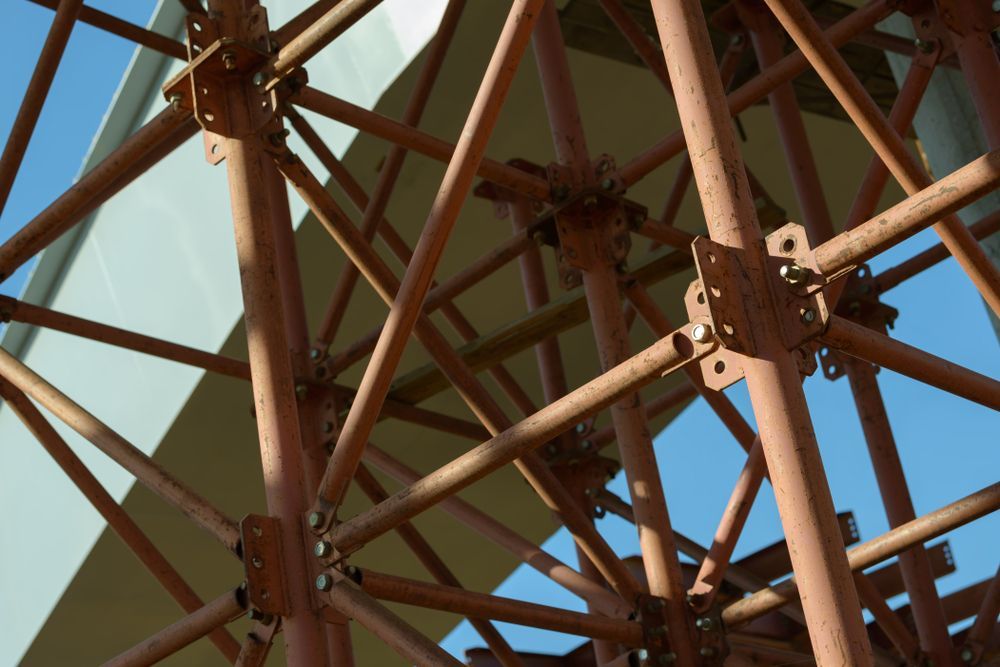 Looking Up at a Metal Structure With a Blue Sky in the Background — NRS Scaffolding Pty Ltd in Macksville, NSW