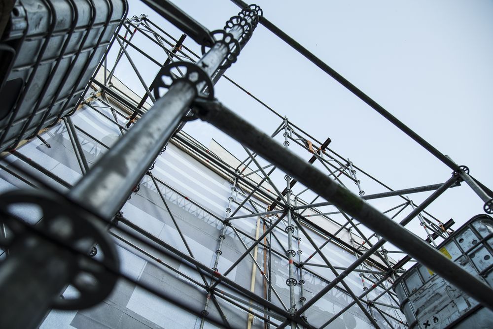 Scaffolding Around a Building, Seen From a Low Angle Against a Pale Sky — NRS Scaffolding Pty Ltd in Laurieton, NSW