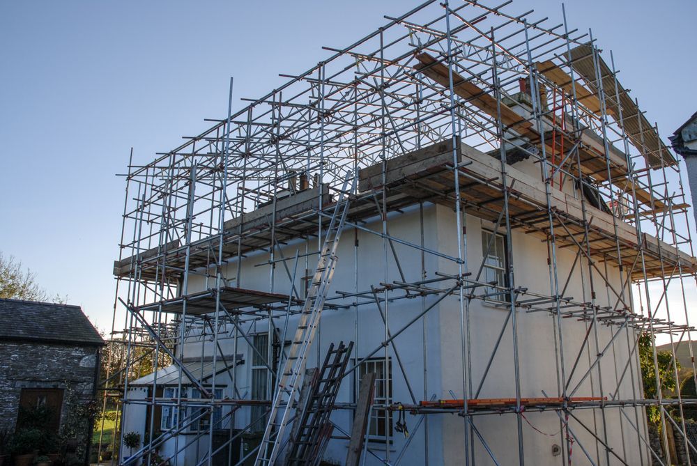 A House is Being Built With Scaffolding Around It — NRS Scaffolding Pty Ltd in Clarence Valley, NSW