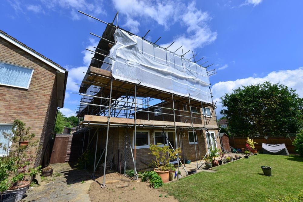 A House is Being Built With Scaffolding Around It — NRS Scaffolding Pty Ltd in Grafton, NSW