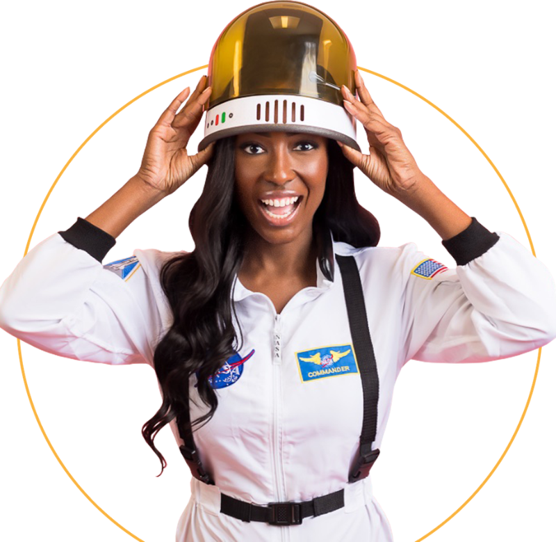 Woman in a white astronaut suit smiling and holding a gold helmet against a white background