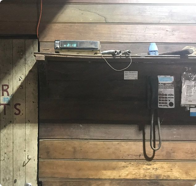 A phone hanging on a wooden wall — Machin's Sawmill Pty Ltd In Wingham, NSW