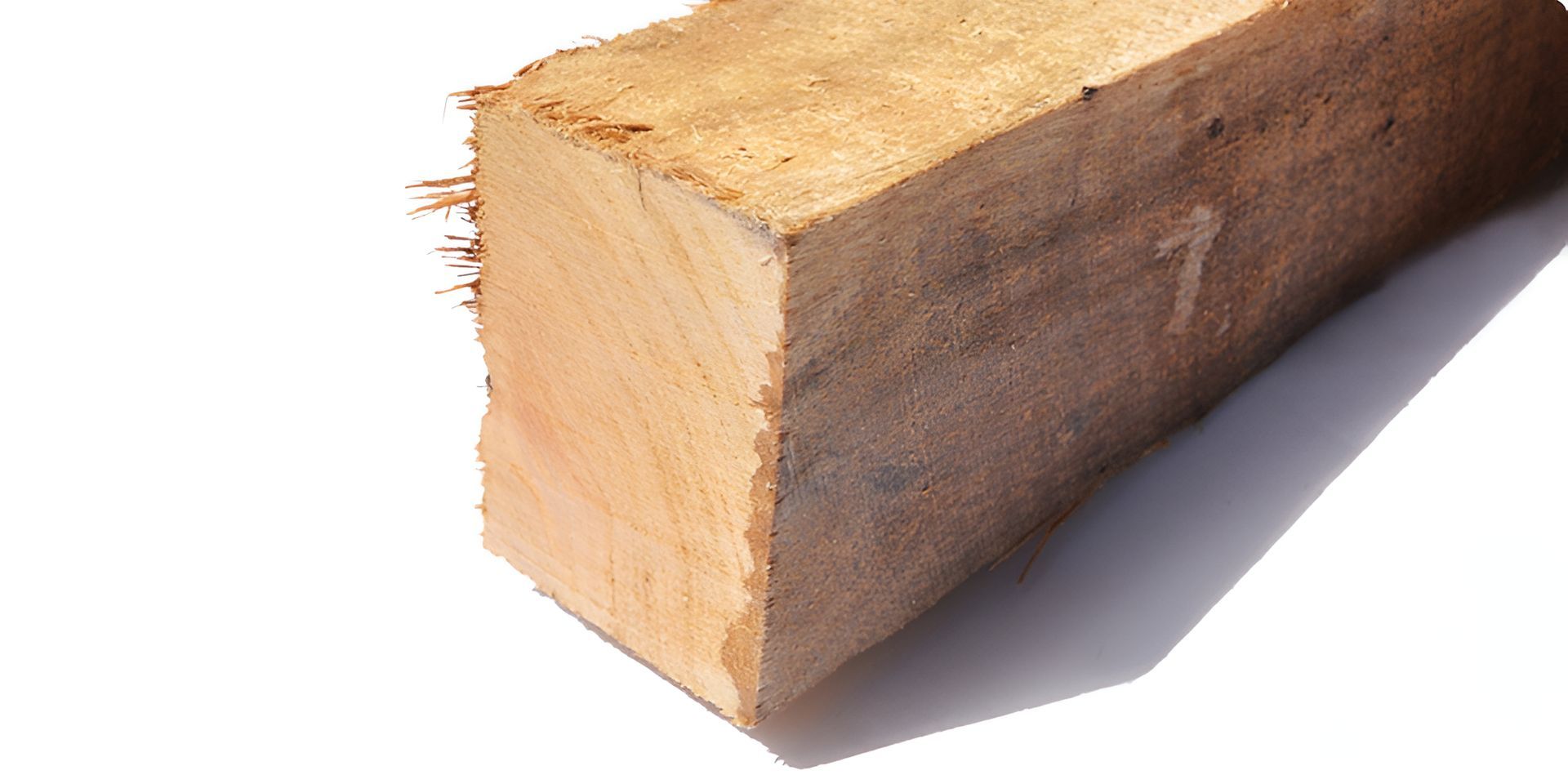 A Piece Of Wood Is Sitting On A White Surface — Machin's Sawmill Pty Ltd In Wingham, NSW