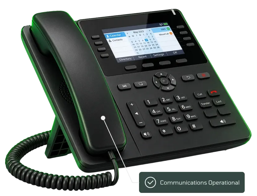 Black office desk phone with lit display, keypad, and handset on cradle