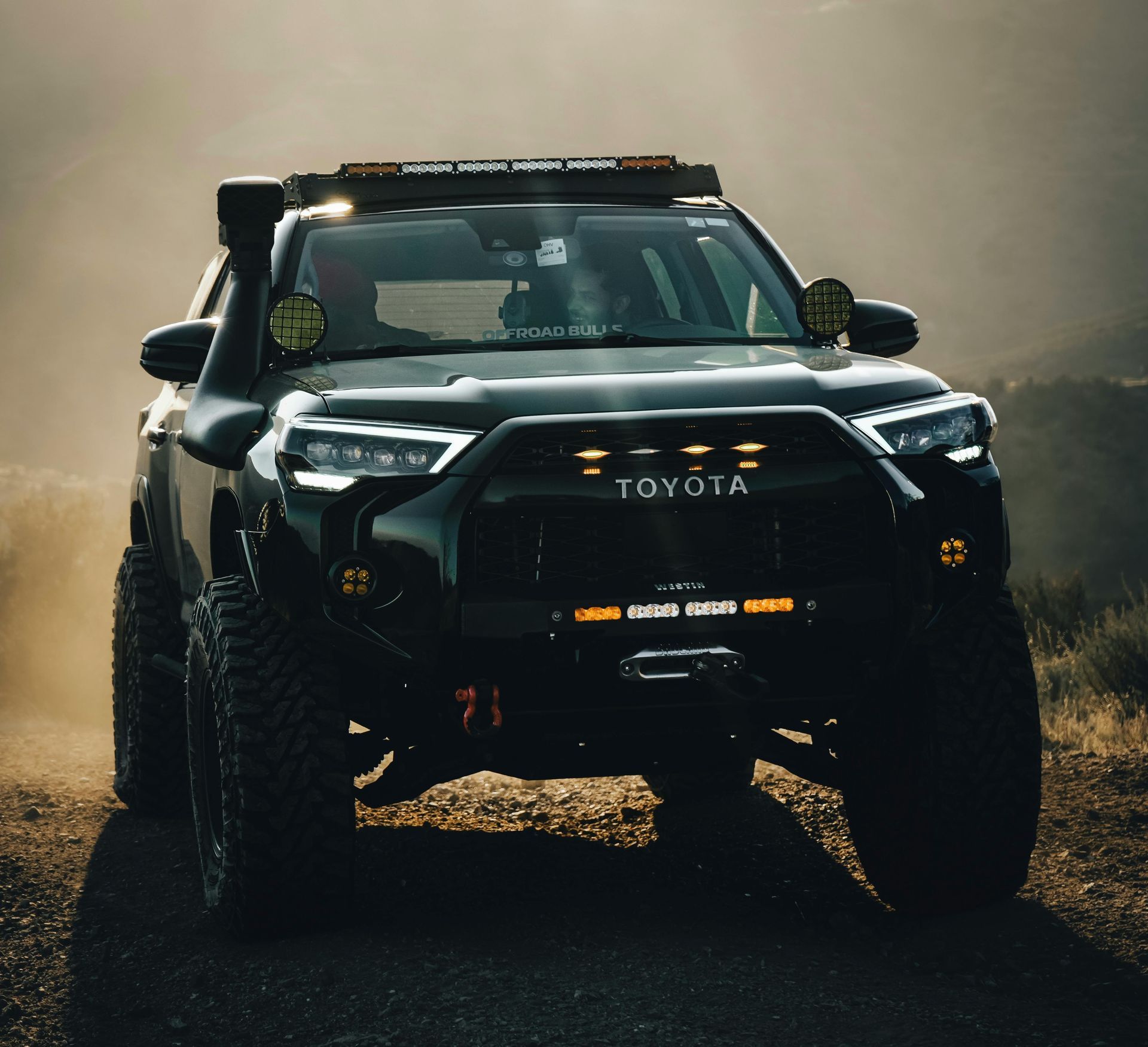 a toyota truck driving in the desert