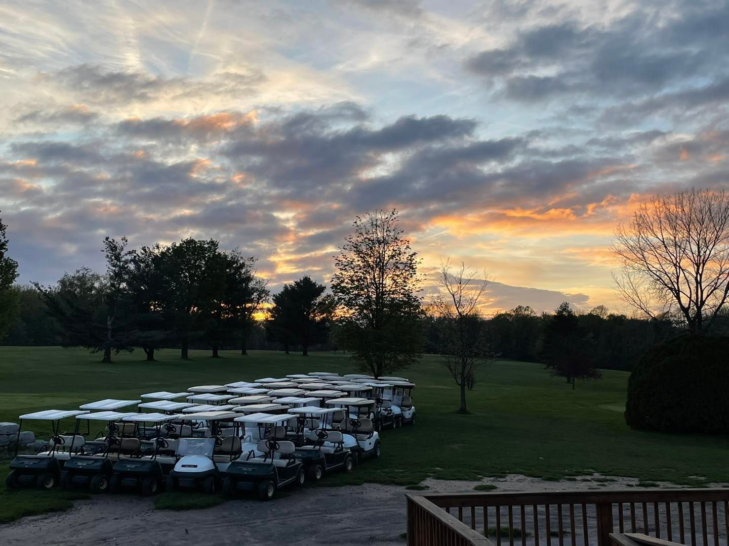 The Wood golf course with sunset on background