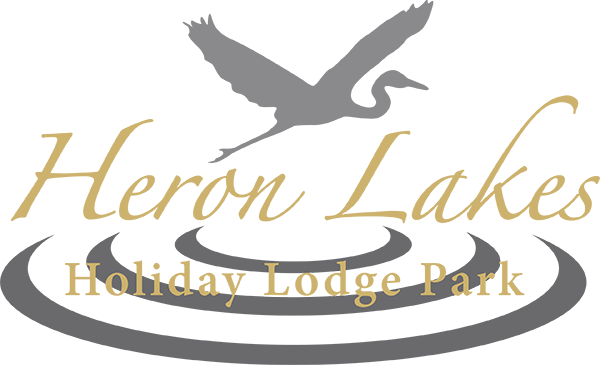 A logo for heron lakes holiday lodge park
