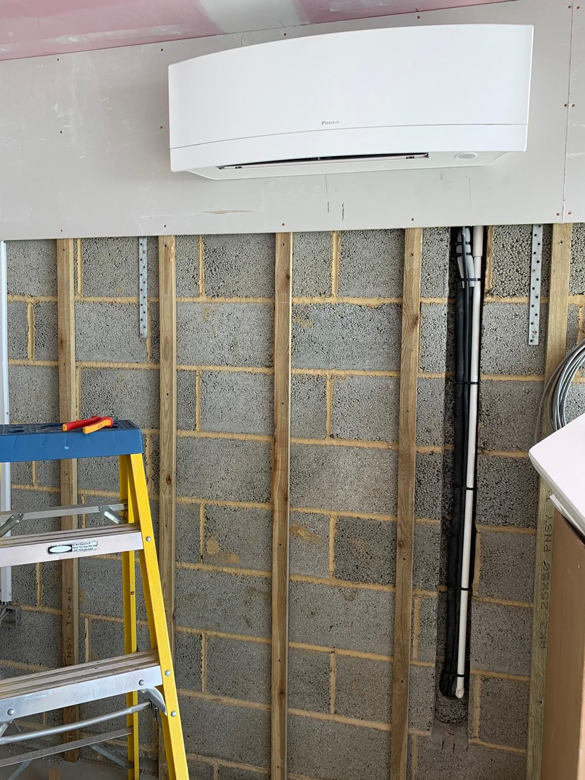 Daikin Emura with services within the walls