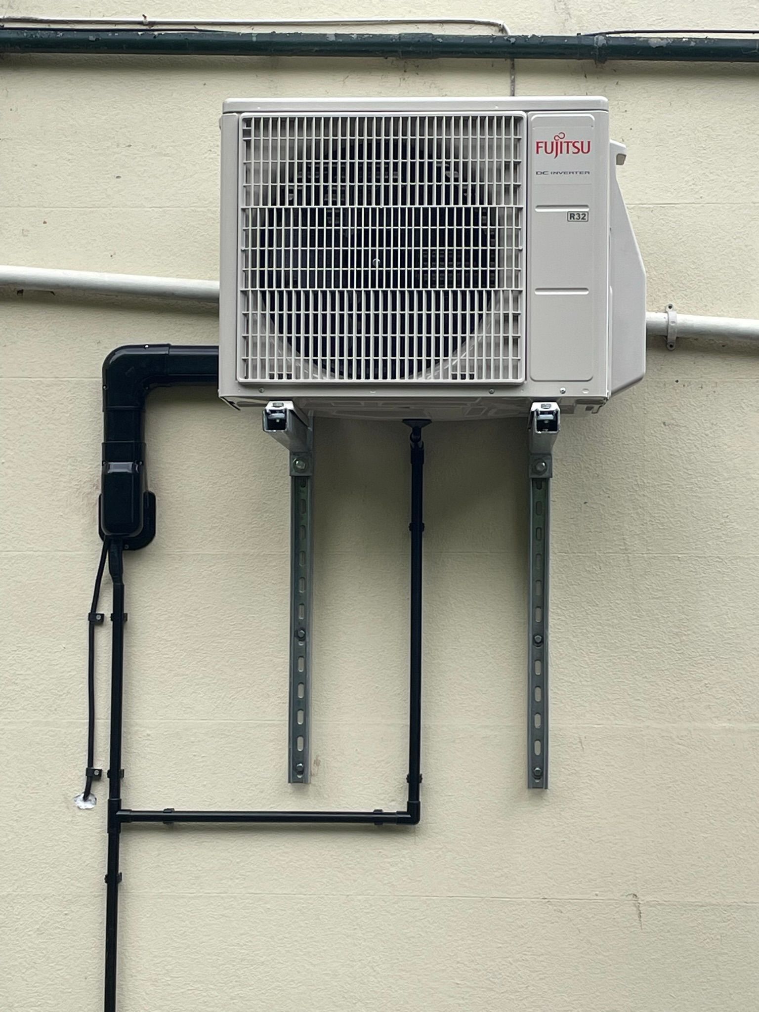 Condenser mounted on brackets
