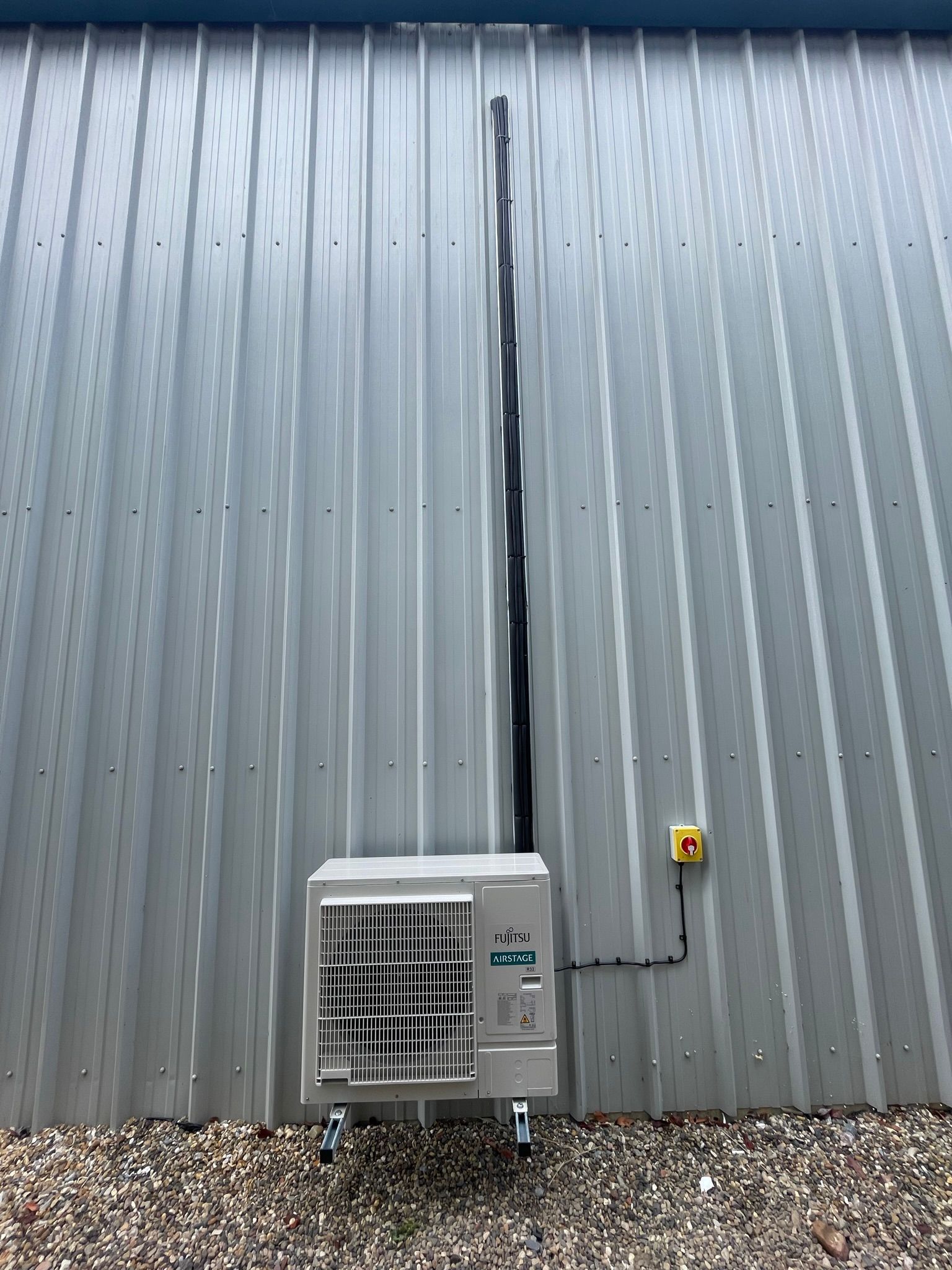 Commercial install - neat services secured to tray down to condenser.