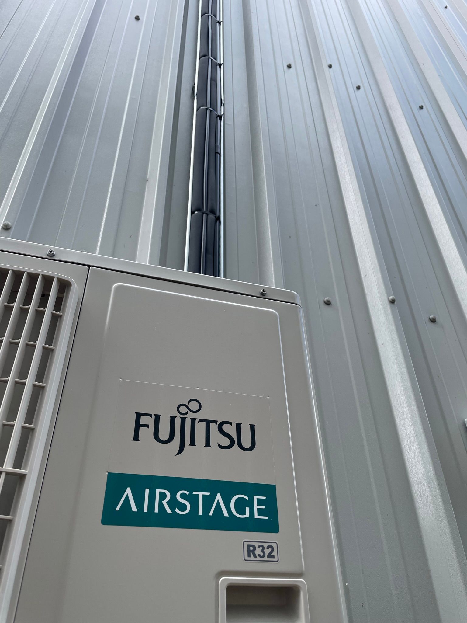 Commercial install - neat services secured to tray down to condenser.