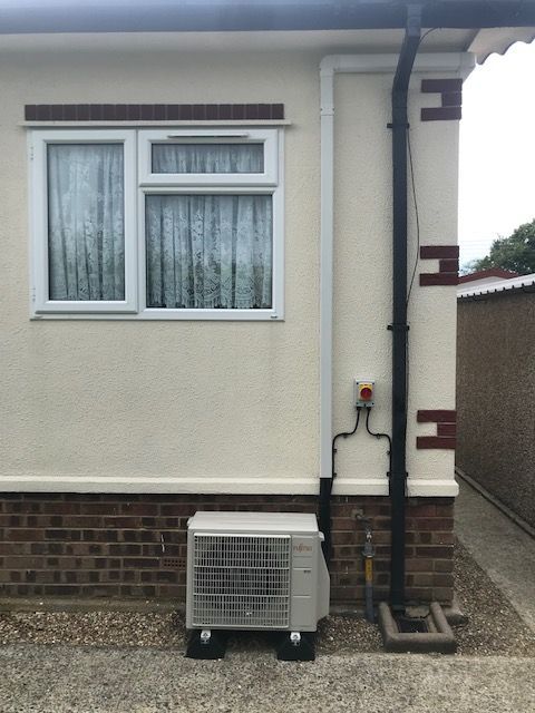 Neat trunking tightly installed high before dropping down to the condenser