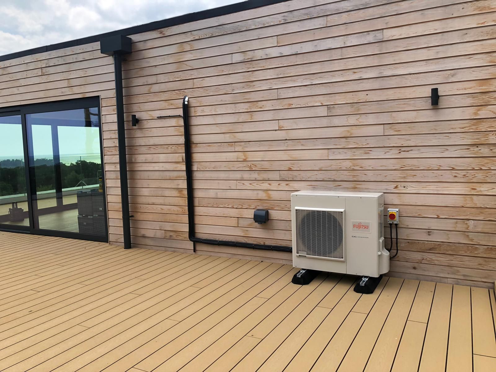 Broadstairs installation. Condenser on the decking