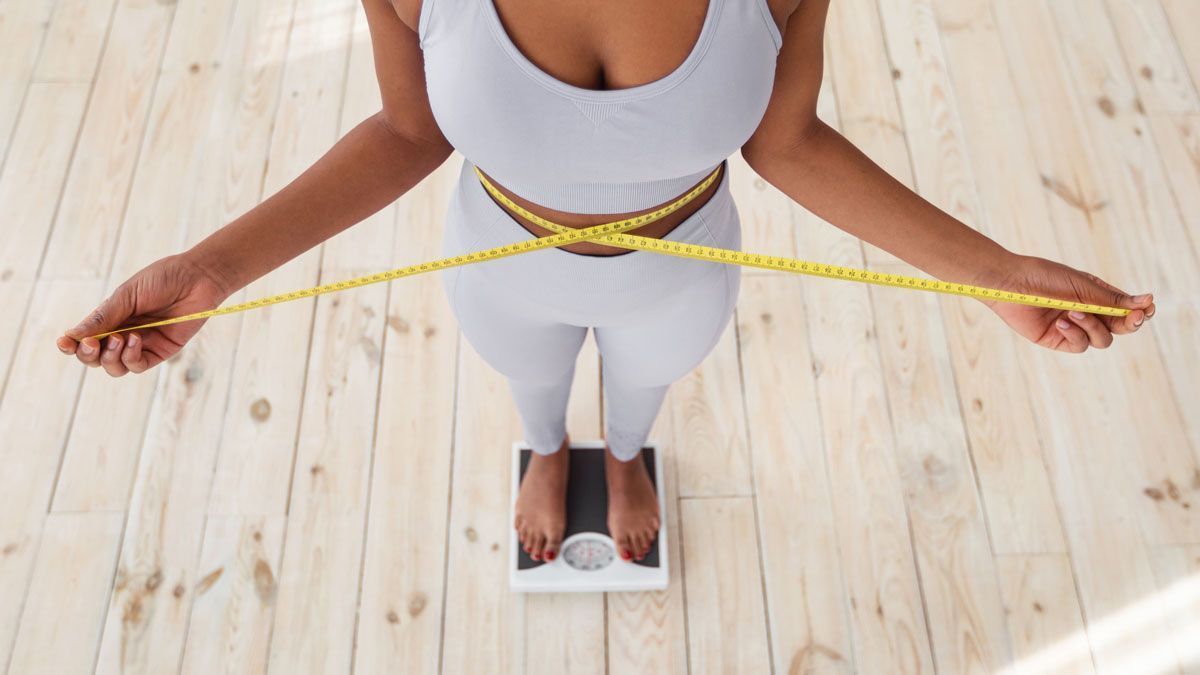 Woman with Tape Measure