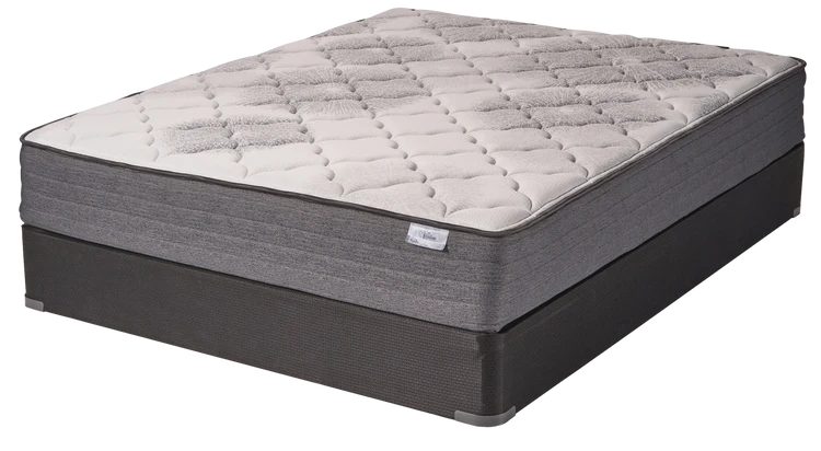 Beige quilted mattress on a dark gray base, shown at an angle on a white background